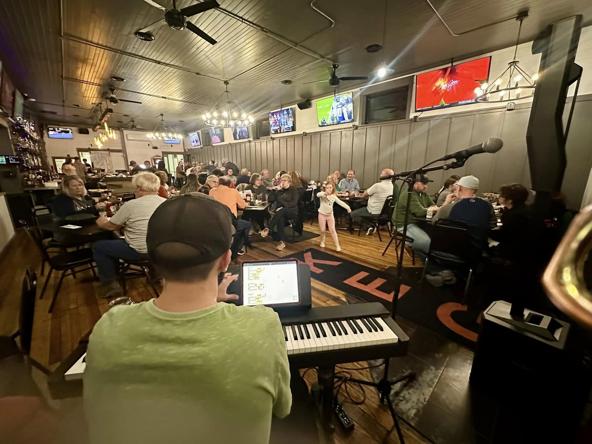 Devin Frank performing piano for a live audience.